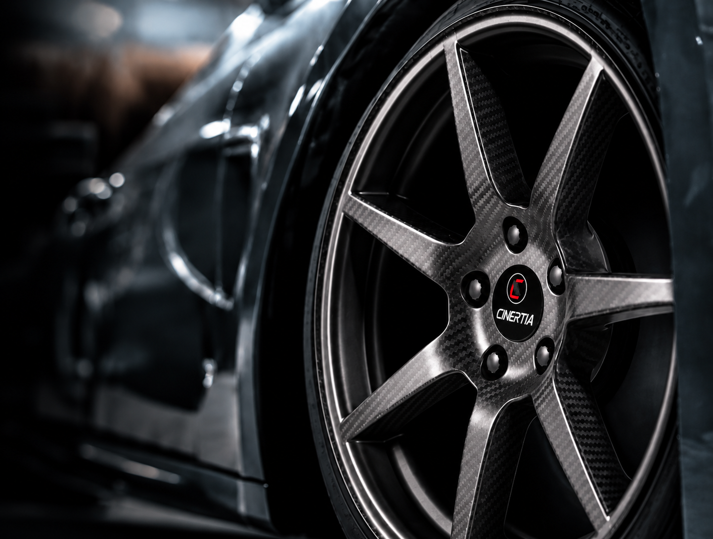 Detail of a C-INERTIA carbon wheel fitted to a sports car