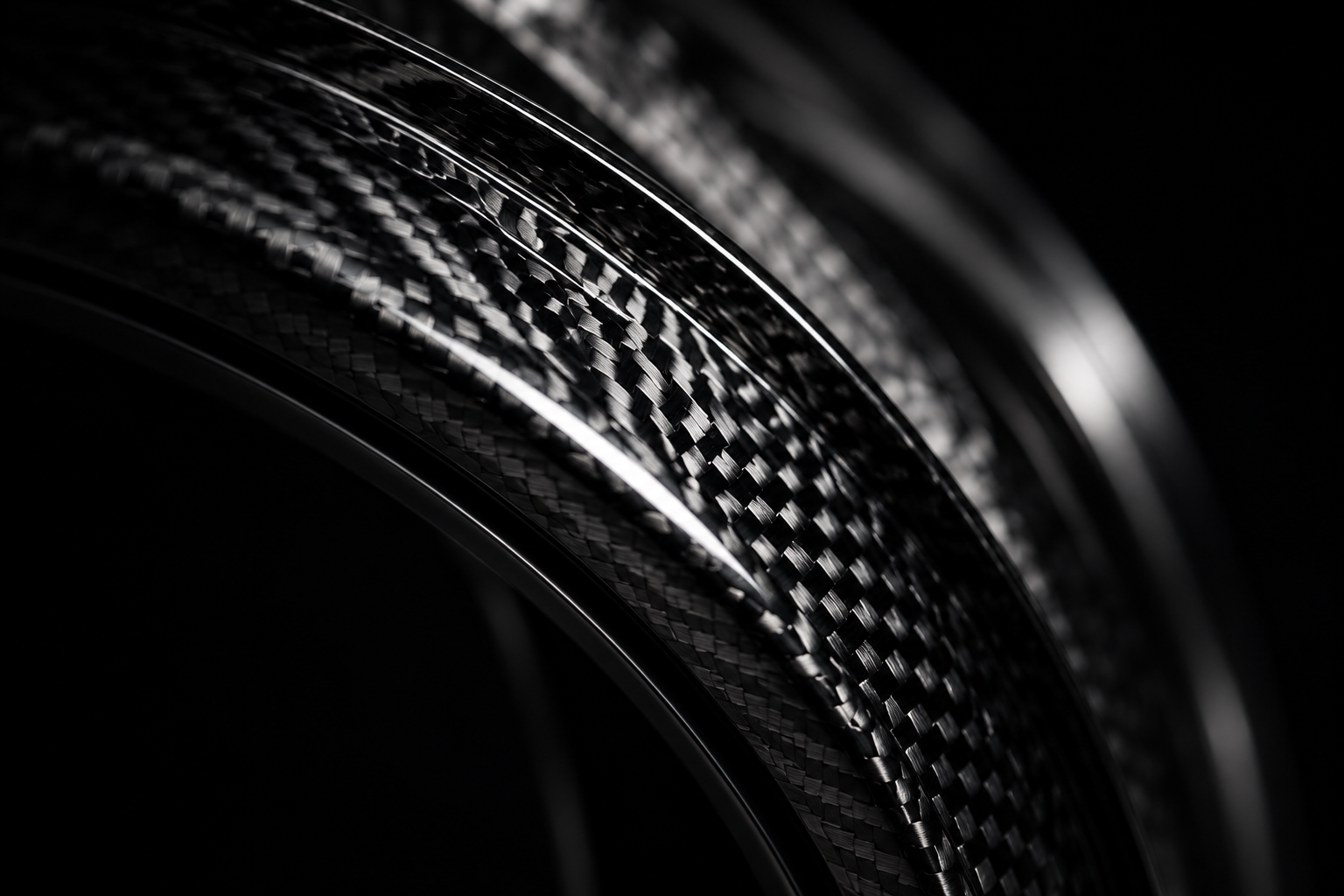 Close-up of the woven carbon structure of a wheel rim