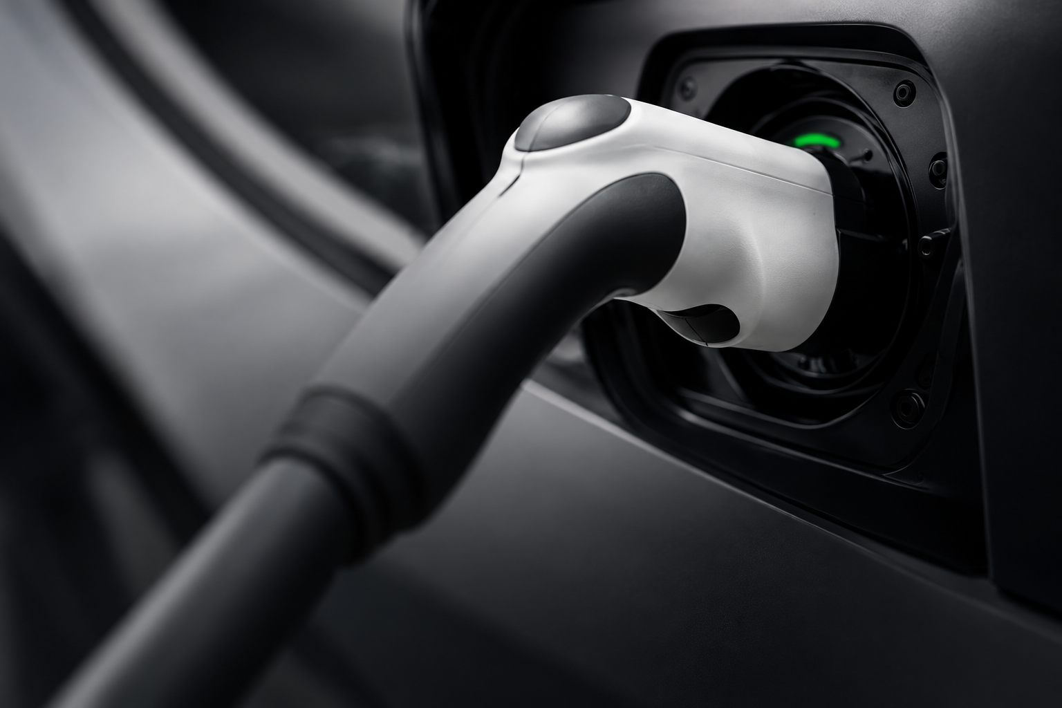 Charging connector plugged into an electric vehicle